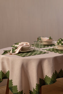  Three place settings with pink and green placemats